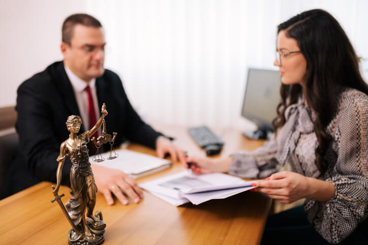 Woman meeting with divorce attorney