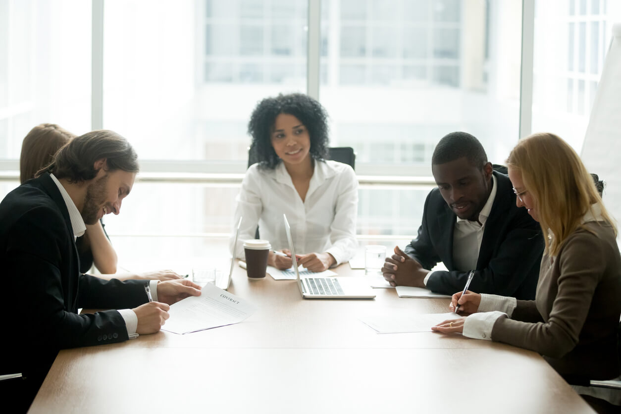couple with attorneys in a mediation session